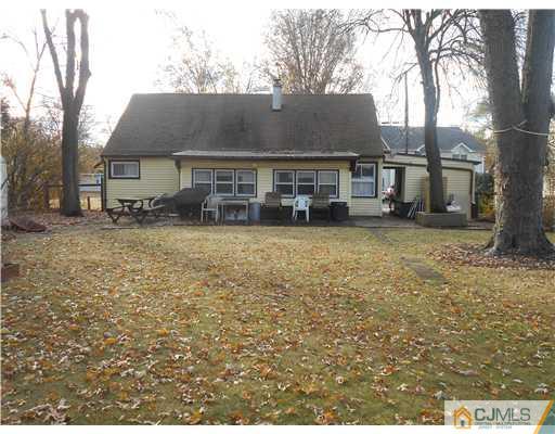 27 Caldwell Road Edison, NJ 08817 - Photo 2 of 3 front view of a house with a yard