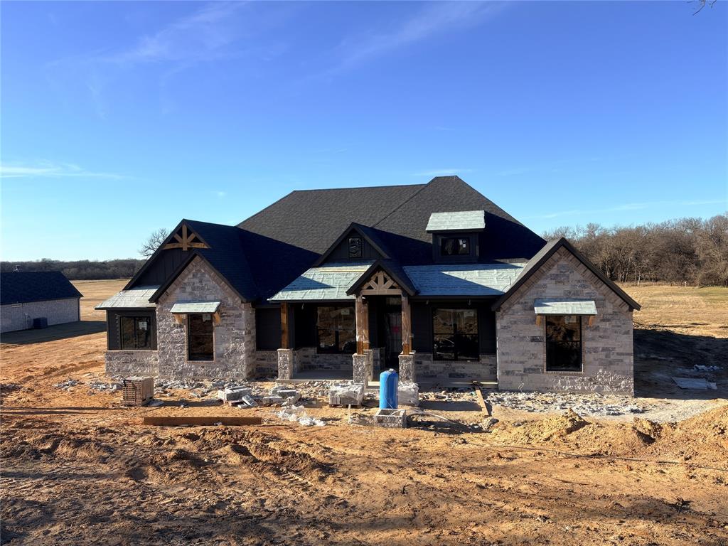 195 Rio Rancho Drive Decatur, TX 76234 - Photo 2 of 2 a front view of a house with a yard