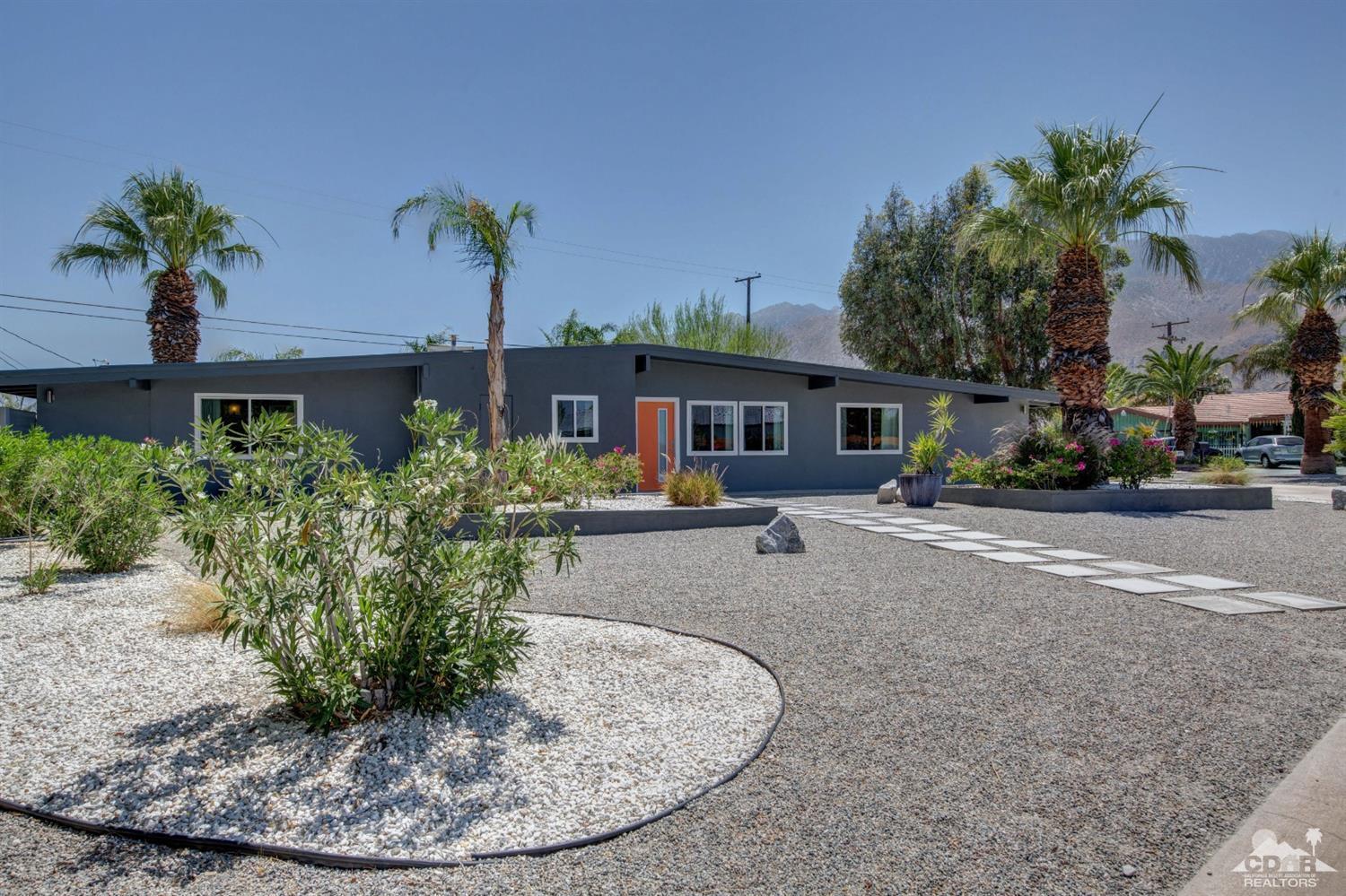 1950 North Magnolia Road Palm Springs, CA 92262 - Photo 2 of 36 a view of a house with a cars park side of a road