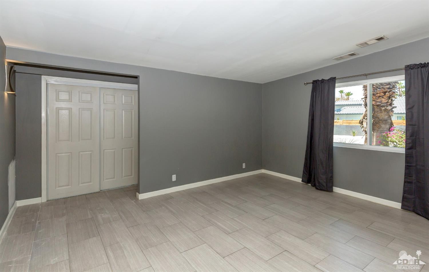 1950 North Magnolia Road Palm Springs, CA 92262 - Photo 16 of 36 an empty room with windows