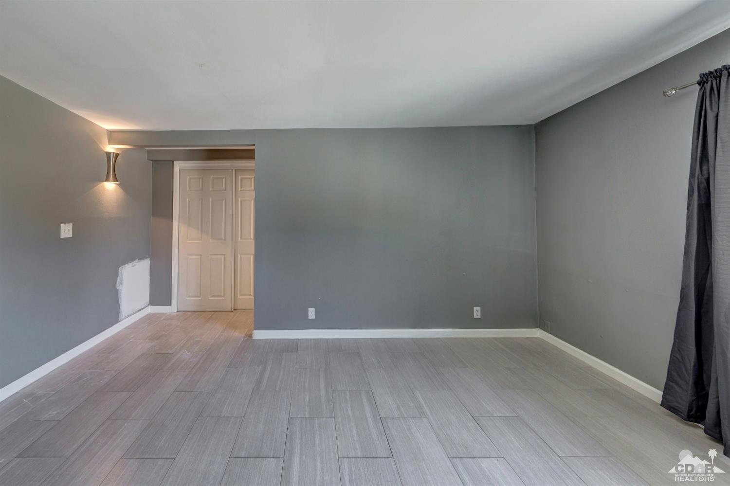 1950 North Magnolia Road Palm Springs, CA 92262 - Photo 17 of 36 a view of an empty room with wooden floor