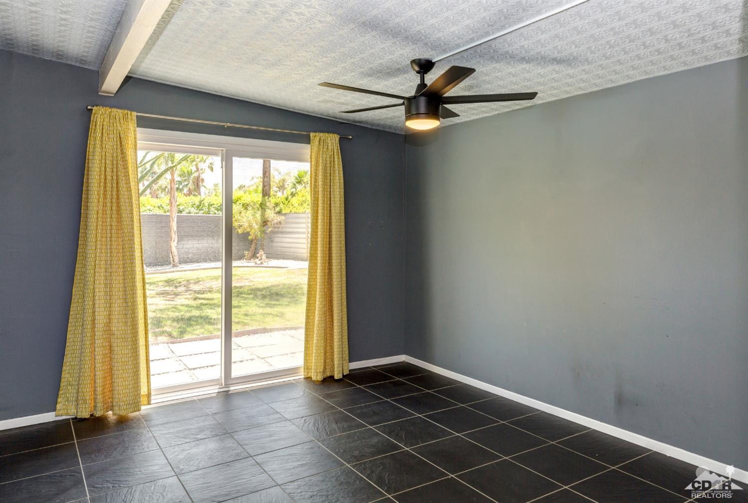 1950 North Magnolia Road Palm Springs, CA 92262 - Photo 19 of 36 a view of a livingroom with a ceiling fan and window
