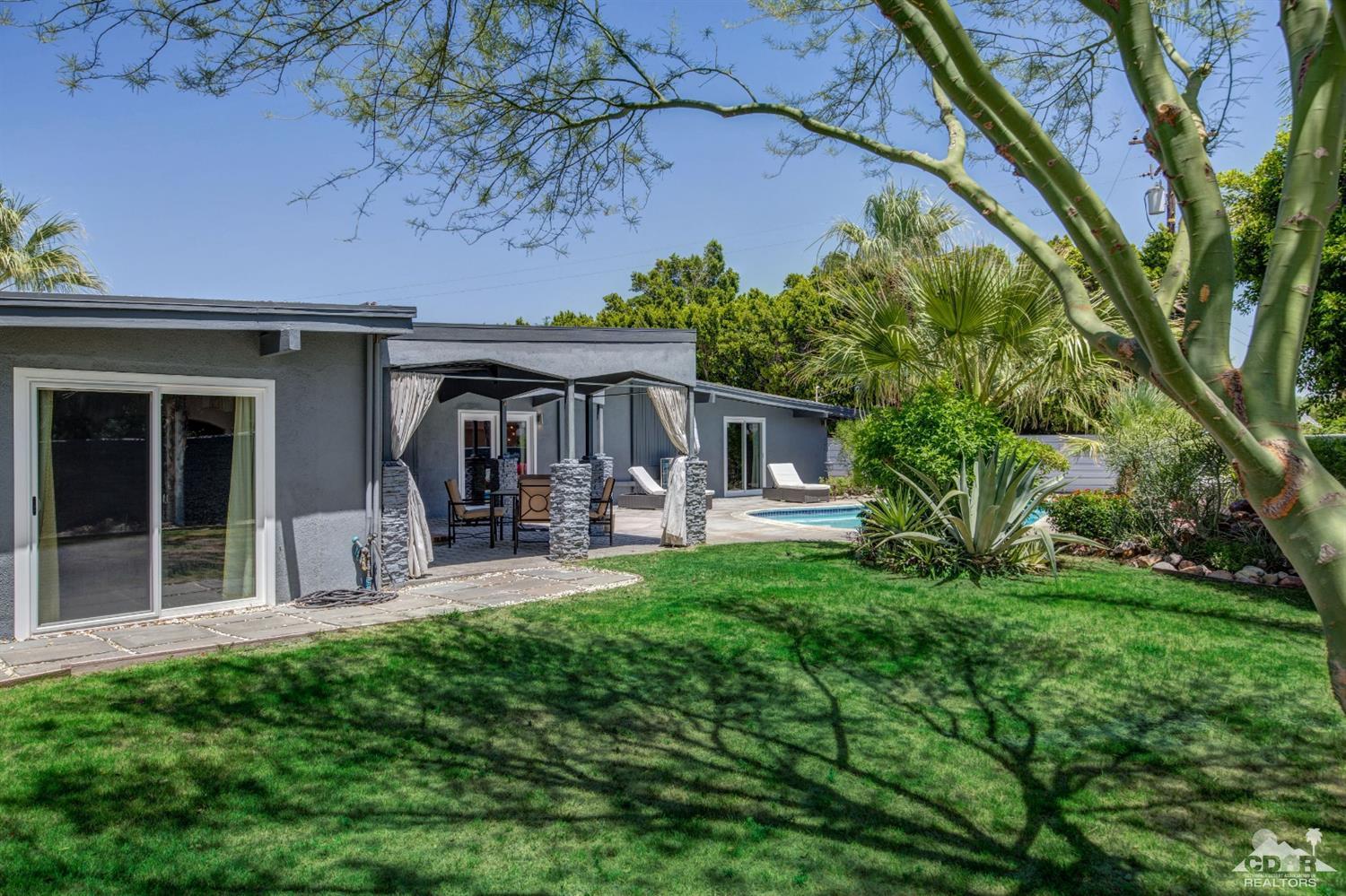 1950 North Magnolia Road Palm Springs, CA 92262 - Photo 27 of 36 a front view of a house with patio and garden
