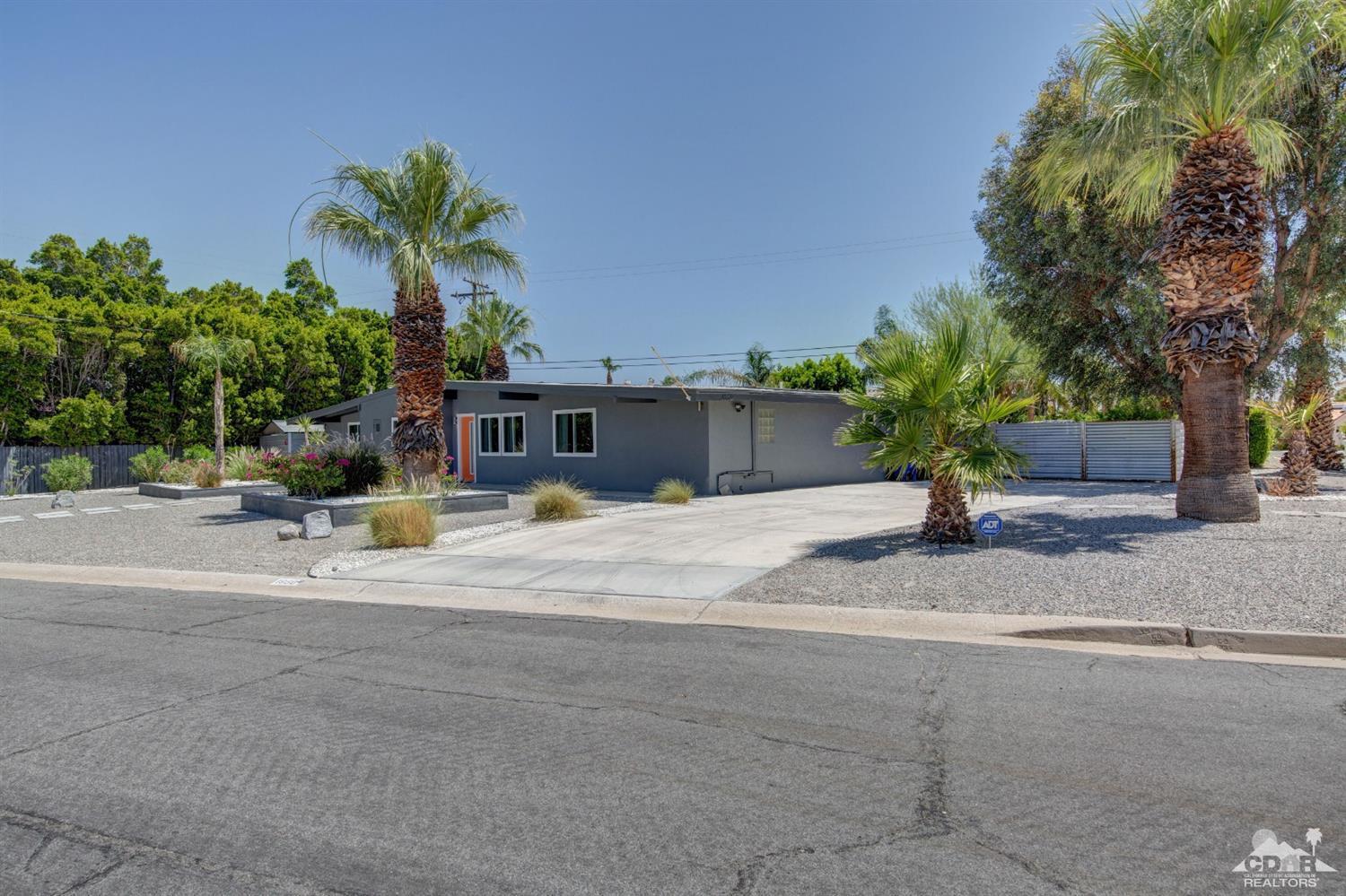 1950 North Magnolia Road Palm Springs, CA 92262 - Photo 32 of 36 a view of a house with a patio and a yard