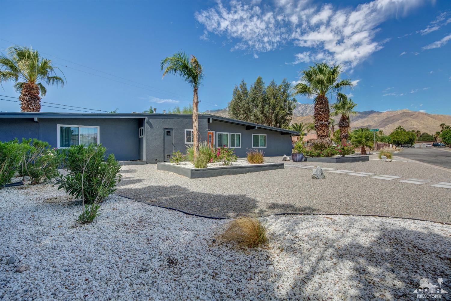 1950 North Magnolia Road Palm Springs, CA 92262 - Photo 34 of 36 a view of a house with a yard and a garage