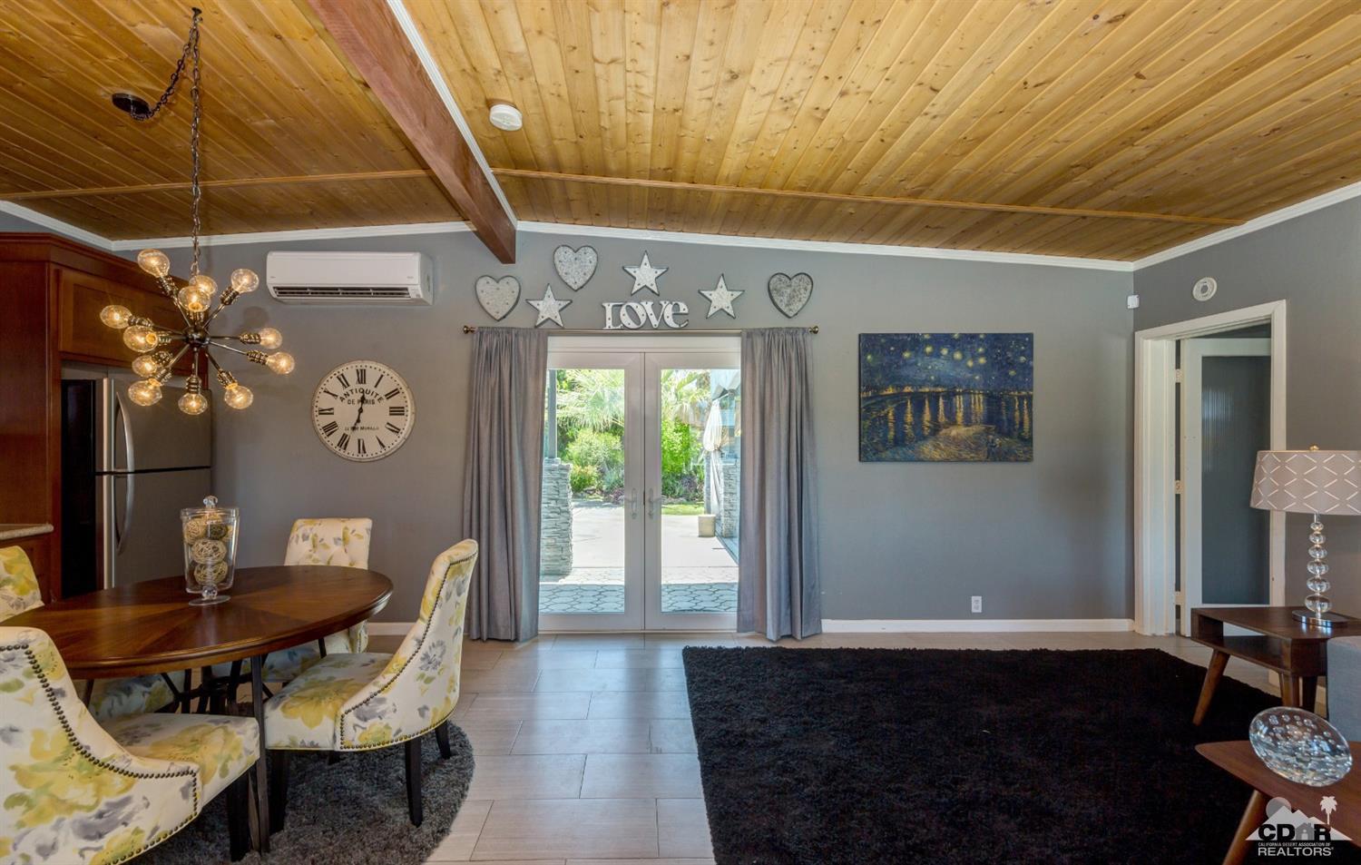 1950 North Magnolia Road Palm Springs, CA 92262 - Photo 5 of 36 a view of a dining room with furniture and window