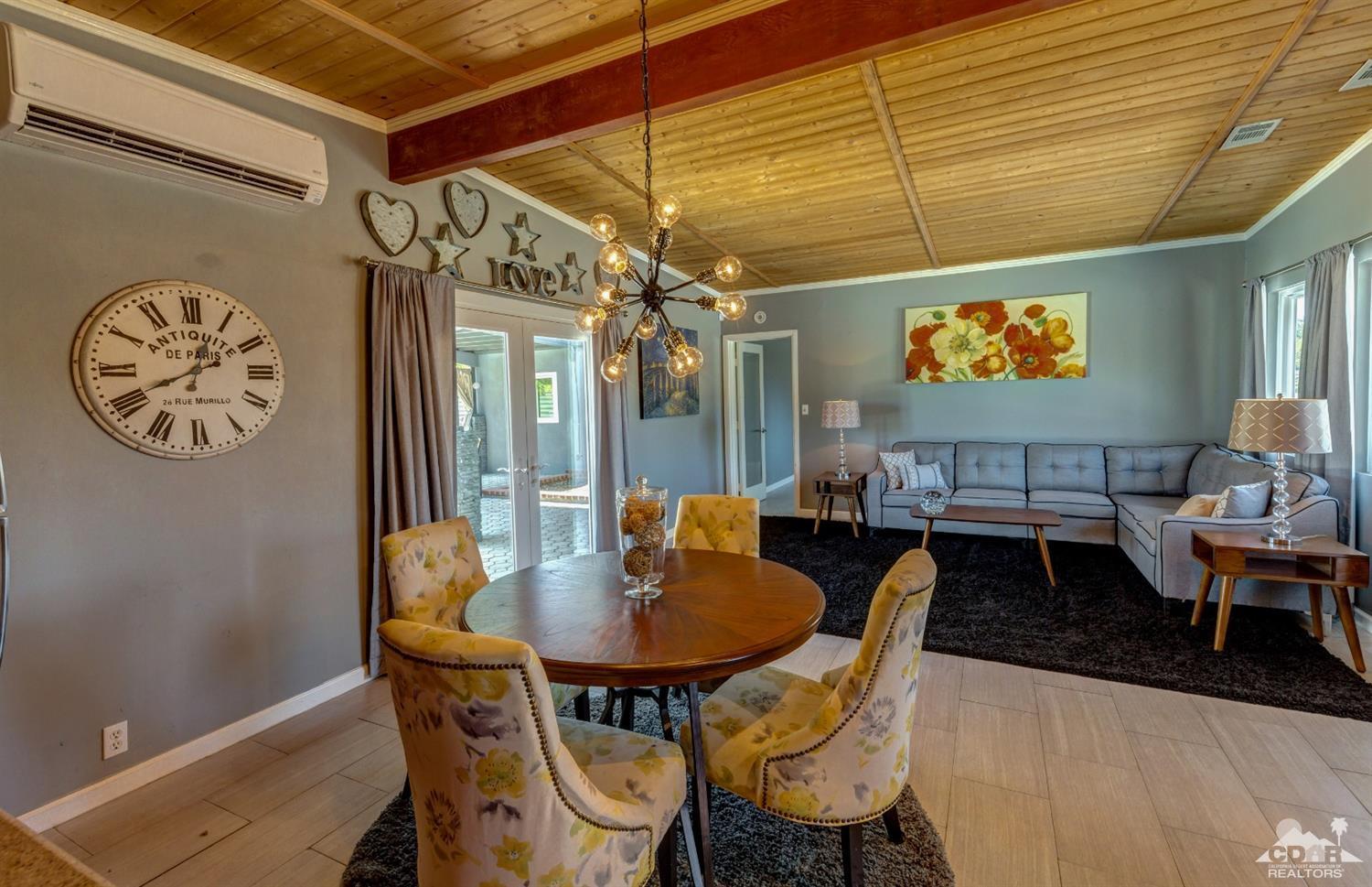 1950 North Magnolia Road Palm Springs, CA 92262 - Photo 9 of 36 a dining room with furniture and window