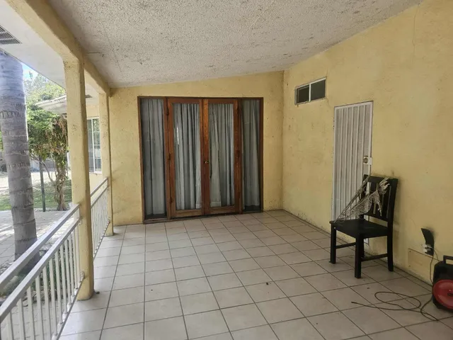 a view of a room with windows