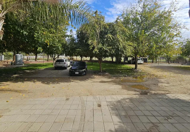 a backyard of a house with lots of green space