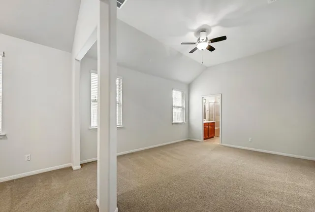 a view of a room with wooden floor and chandelier