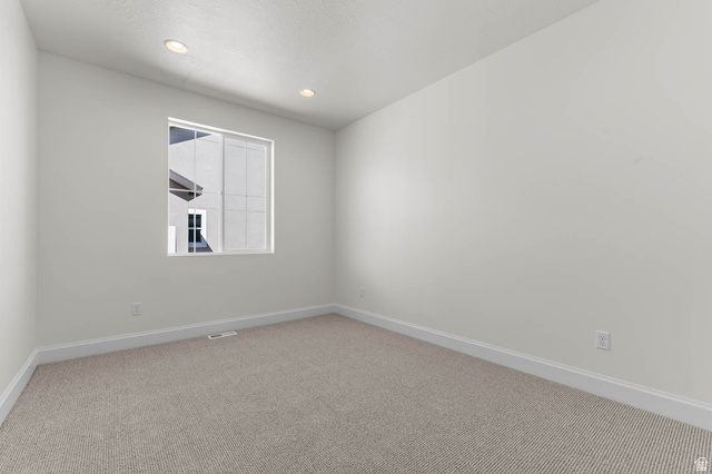 11749 South Halls Crk Road Draper, UT 84020 - Photo 9 of 21 Unfurnished room with light carpet and recessed lighting