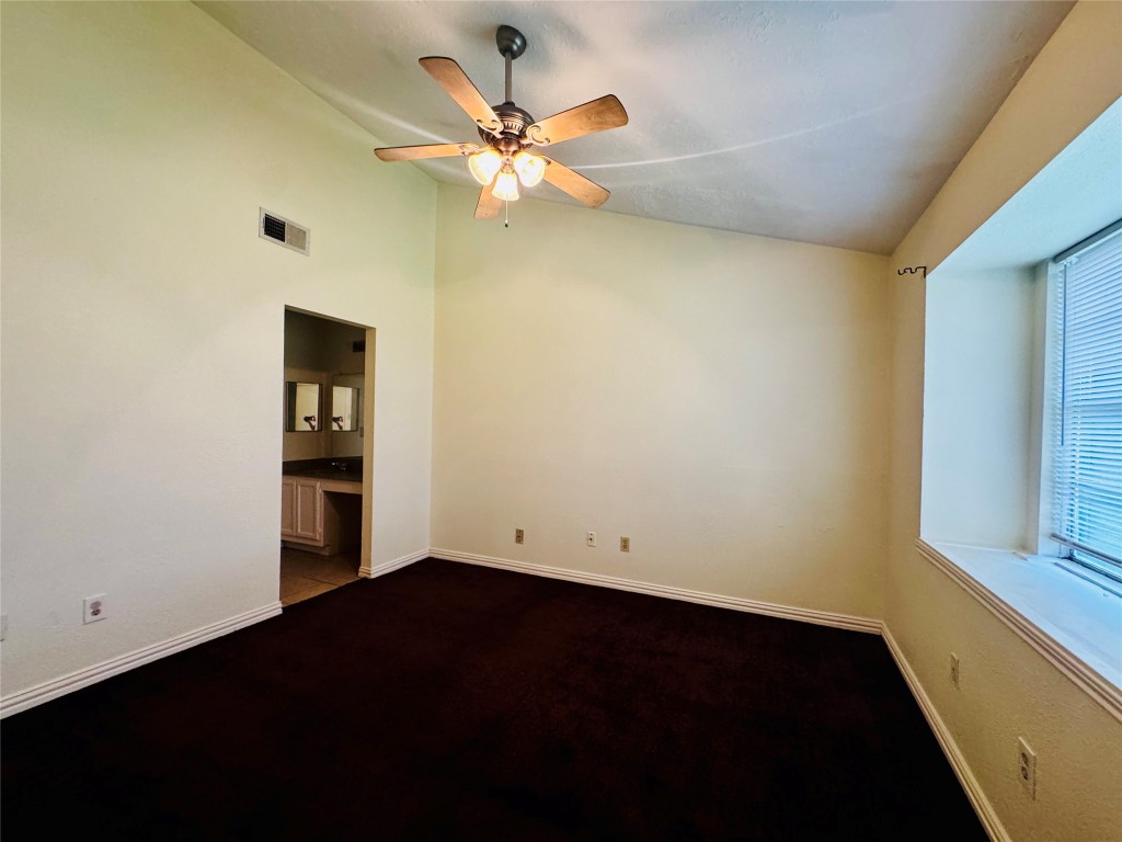 17118 Amber Ridge Drive Sugar Land, TX 77498 - Photo 14 of 20 an empty room with a window and a ceiling fan