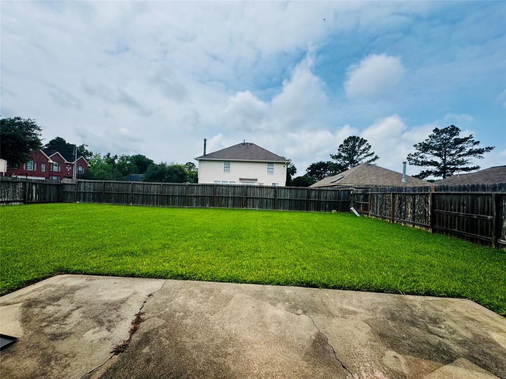 17118 Amber Ridge Drive Sugar Land, TX 77498 - Photo 19 of 20 a wooden bench sitting in middle of the middle of a park