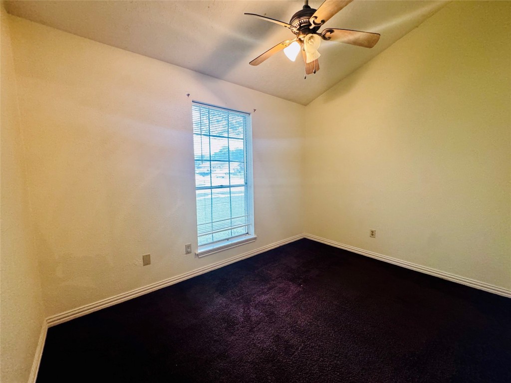 17118 Amber Ridge Drive Sugar Land, TX 77498 - Photo 7 of 20 an empty room with windows and fan