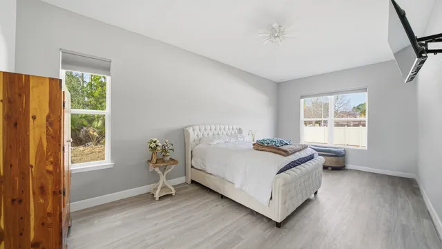 a living room with a bed furniture and a window