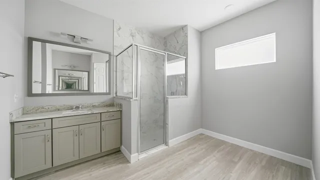 a bathroom with a sink and a mirror