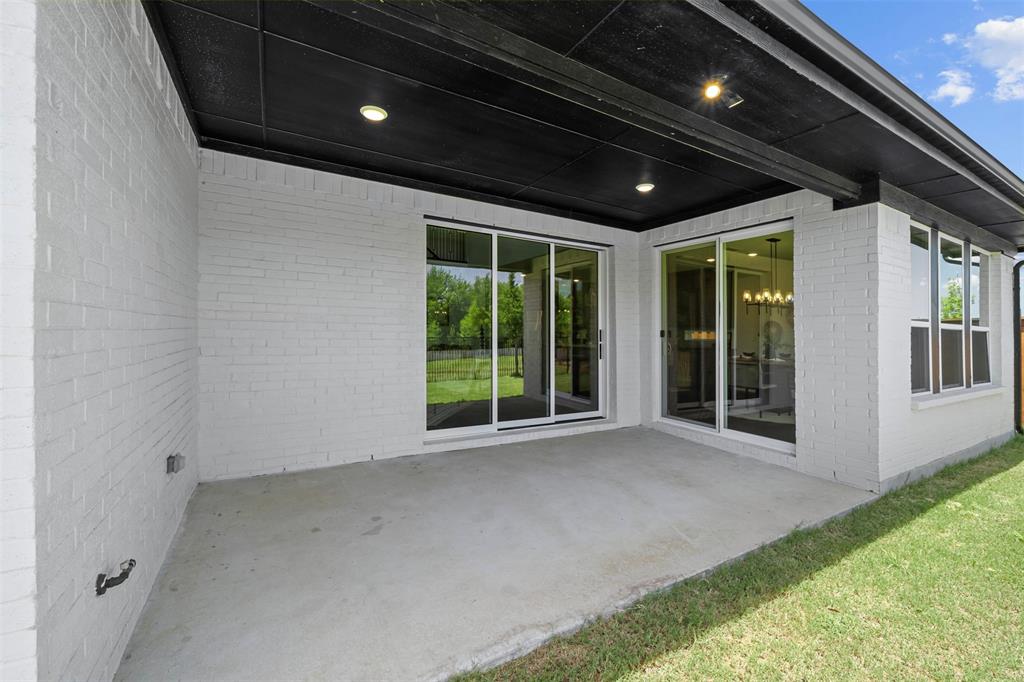 1173 Rochester Place Copper Canyon, TX 75077 - Photo 3 of 34 The property features a covered patio with recessed lighting and a concrete surface, providing a versatile outdoor space