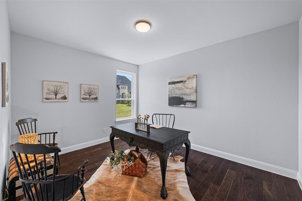 1173 Rochester Place Copper Canyon, TX 75077 - Photo 8 of 34 This room features light-colored walls, dark hardwood flooring, and a window providing natural light and views of the exterior