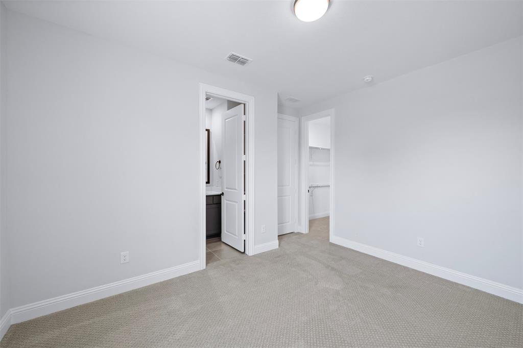 1173 Rochester Place Copper Canyon, TX 75077 - Photo 10 of 34 This room features light grey carpeting, white baseboards, and neutral-toned walls