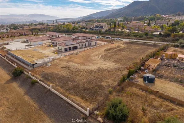 an aerial view of residential houses with city view