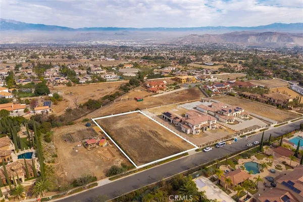 an aerial view of residential building with parking