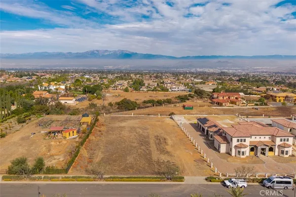 an aerial view of residential building with ocean view