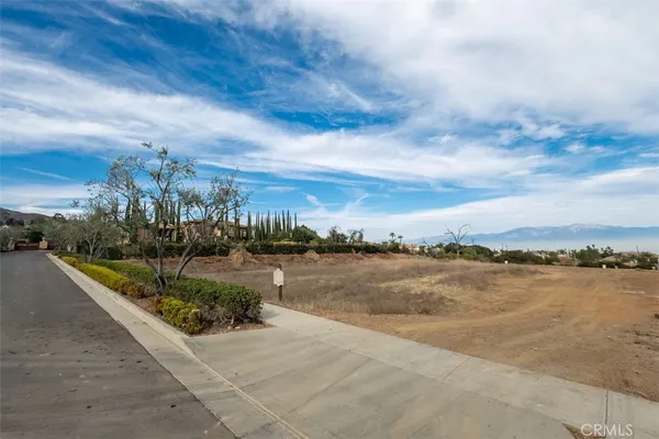 a view of a lake with houses in the back