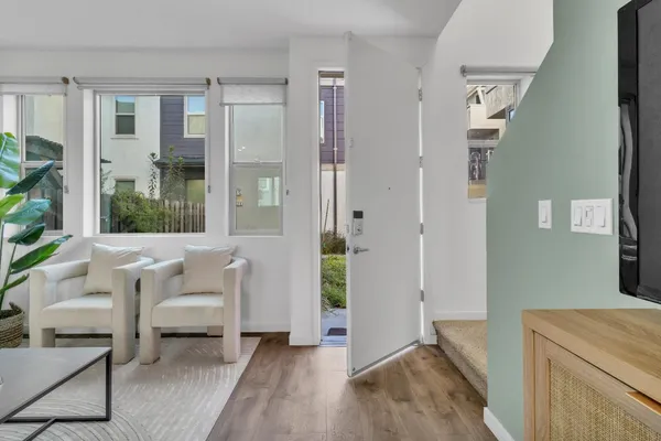 a view of a livingroom with furniture and windows