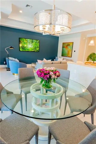 a kitchen that has a stove and a table