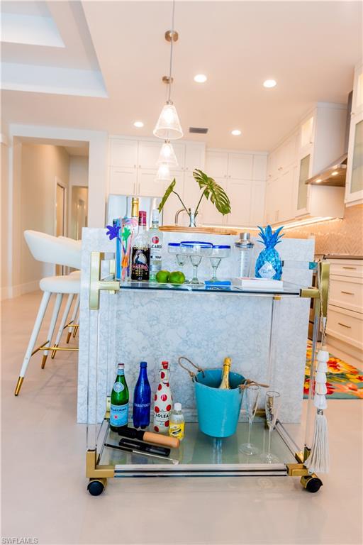 548 101st Avenue North Naples, FL 34108 - Photo 16 of 50 a kitchen with lots of clutter and cabinets