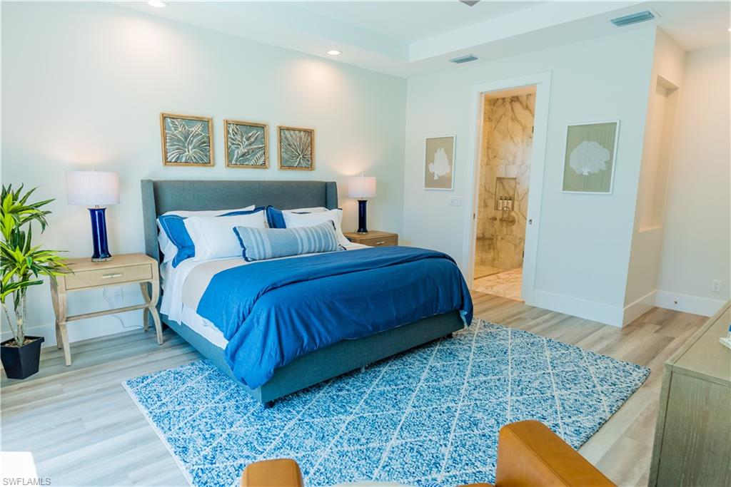 548 101st Avenue North Naples, FL 34108 - Photo 18 of 50 a bedroom with a bed and window