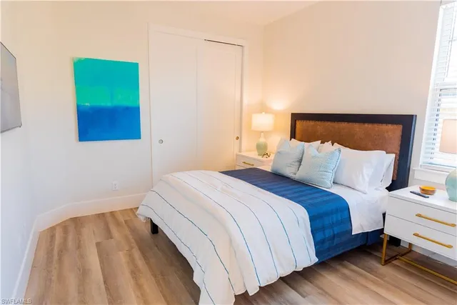 a bedroom with a bed and window