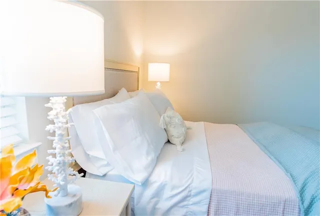 a bedroom with two beds and a window