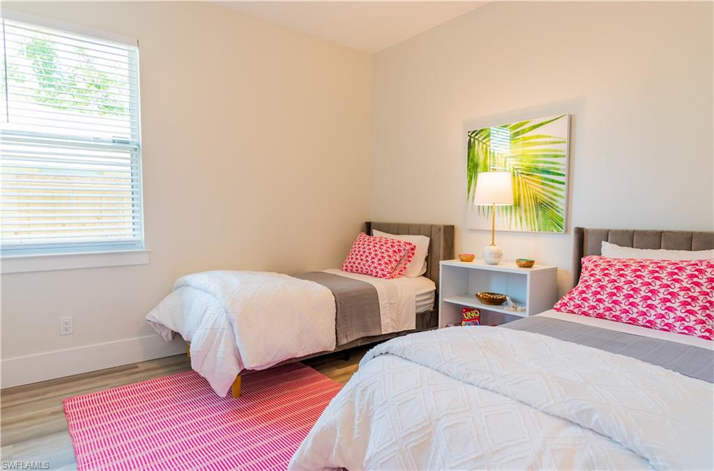 548 101st Avenue North Naples, FL 34108 - Photo 31 of 50 a bedroom with two beds and a window