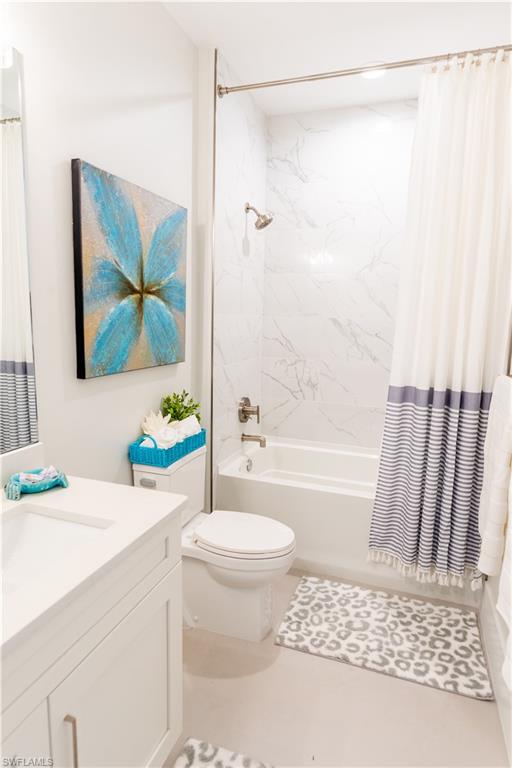548 101st Avenue North Naples, FL 34108 - Photo 33 of 50 a bathroom with a sink toilet and shower