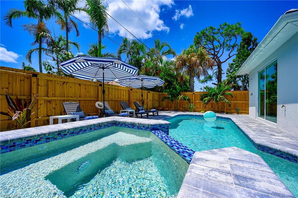 548 101st Avenue North Naples, FL 34108 - Photo 45 of 50 a view of a backyard with plants and a patio