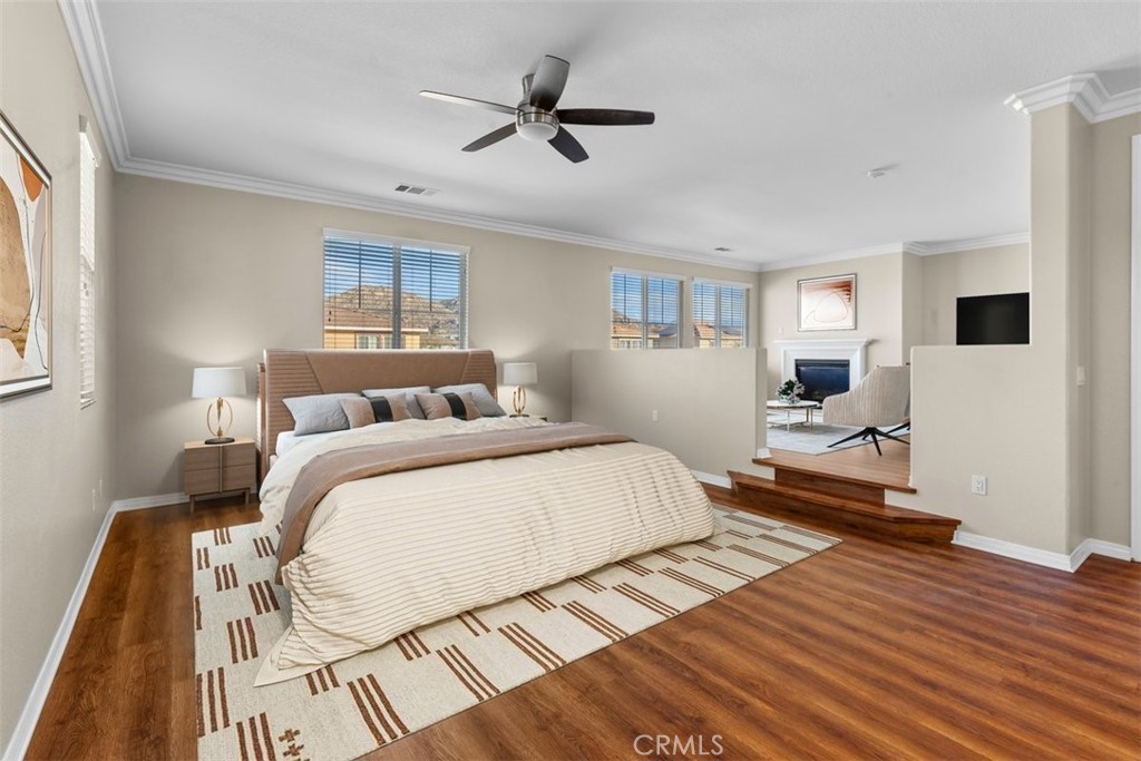 820 Volande Court Perris, CA 92571 - Photo 16 of 37 a bedroom with a bed and wooden floor