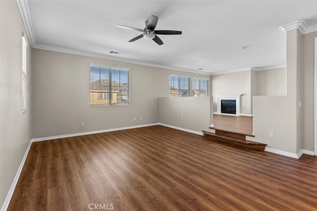 820 Volande Court Perris, CA 92571 - Photo 17 of 37 a view of empty room with wooden floor and fan