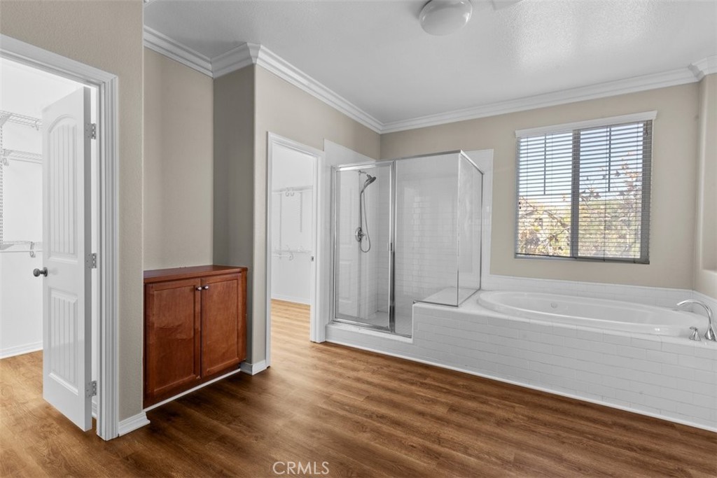 820 Volande Court Perris, CA 92571 - Photo 22 of 37 an empty room with wooden floor and windows
