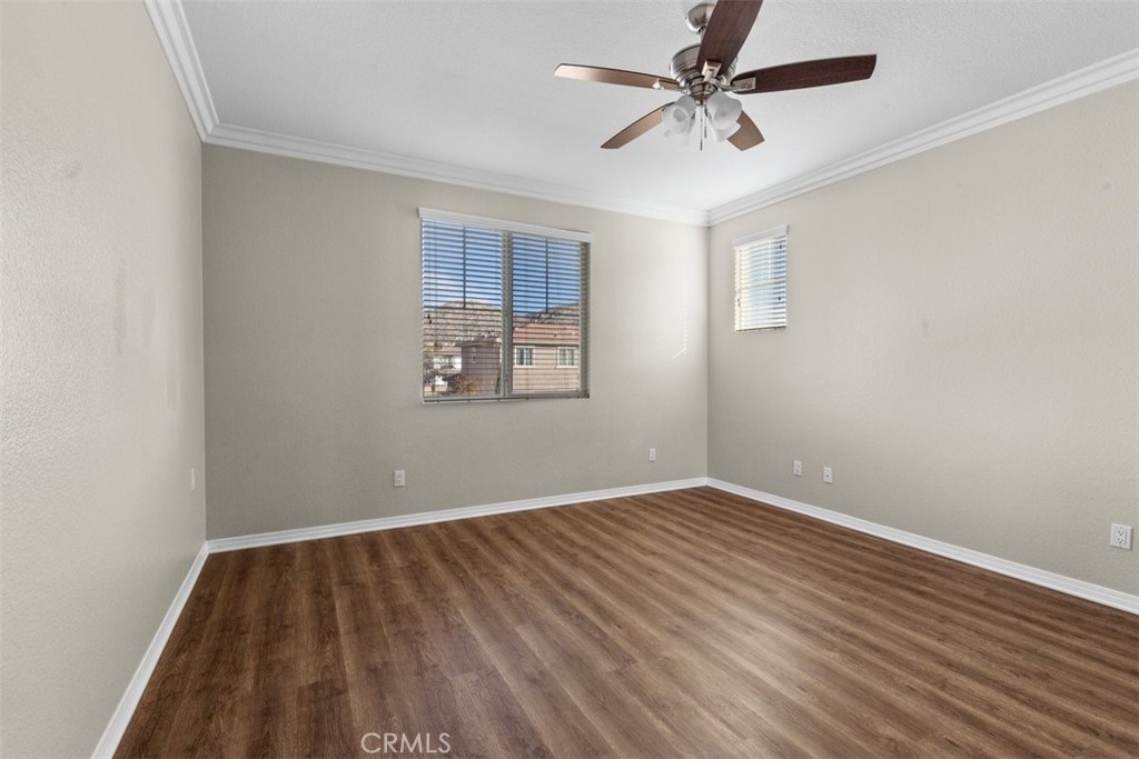 820 Volande Court Perris, CA 92571 - Photo 24 of 37 wooden floor in a empty room with a window