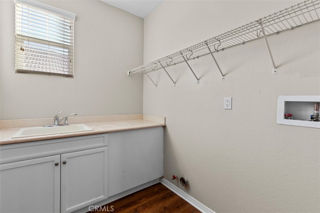 820 Volande Court Perris, CA 92571 - Photo 27 of 37 a bathroom with a sink and vanity