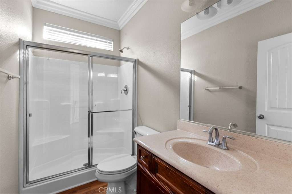 820 Volande Court Perris, CA 92571 - Photo 28 of 37 a bathroom with a sink toilet and shower