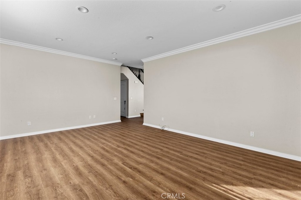 820 Volande Court Perris, CA 92571 - Photo 29 of 37 a view of an empty room with wooden floor