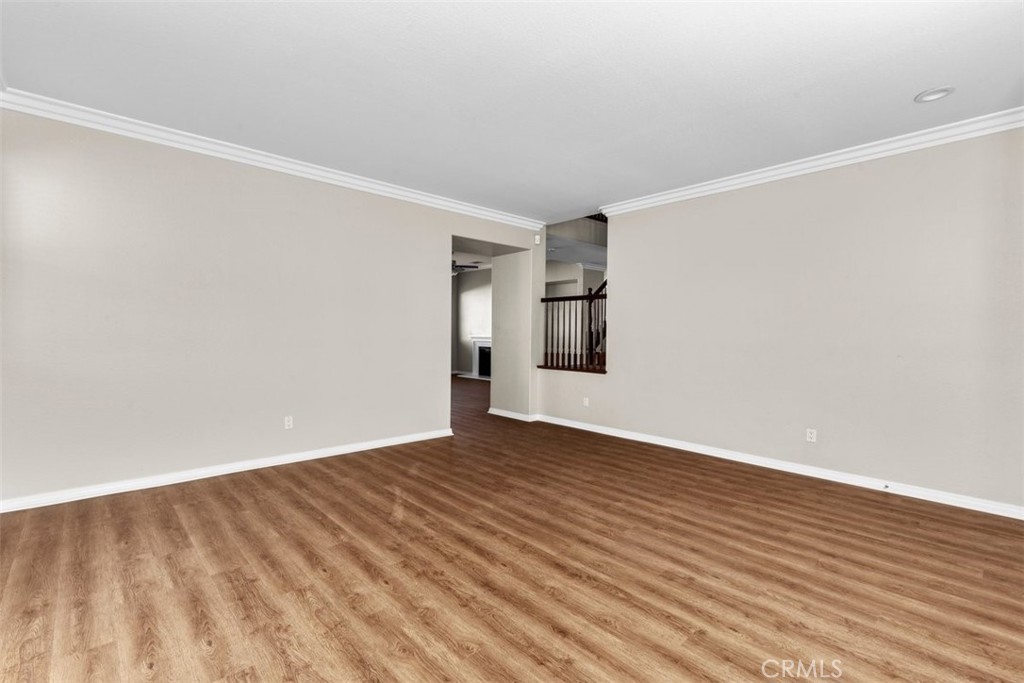 820 Volande Court Perris, CA 92571 - Photo 31 of 37 a view of an empty room with wooden floor