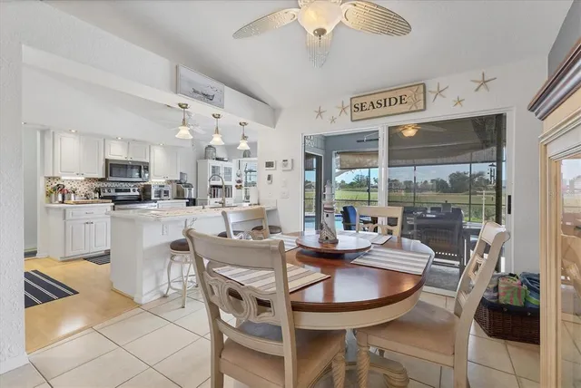 a living room with kitchen island furniture and a wooden floor