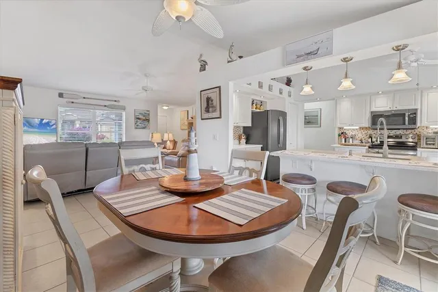 a kitchen with stainless steel appliances granite countertop a sink and a stove