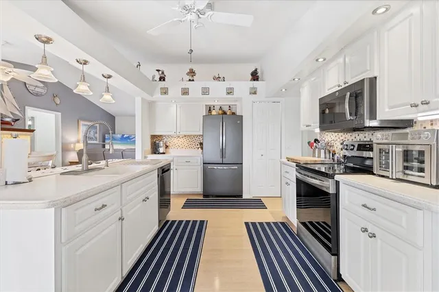a kitchen with a refrigerator a sink and dishwasher