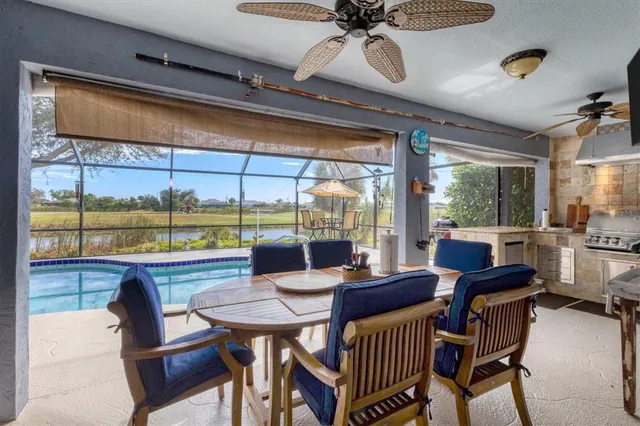 a view of a swimming pool with a patio