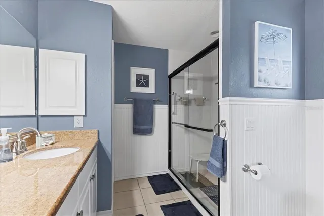 a view of a lake with houses in the back