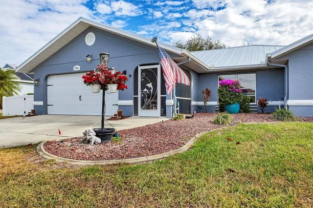 a view of a lake with a swimming pool and outdoor seating